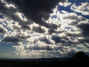 Scenic view of landscape against cloudy sky