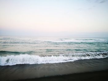 Scenic view of sea against clear sky during sunset