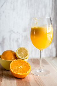 Close-up of orange juice in glass on table