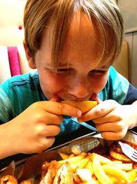 Close-up of boy eating food