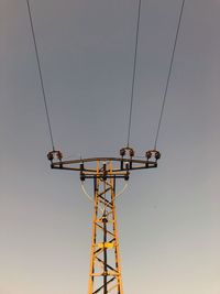 Low angle view of communications tower against sky