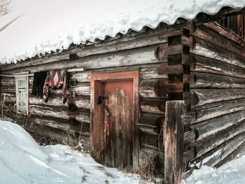 Abandoned building covered with snow