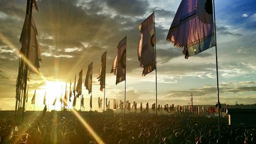 Panoramic view of flags hanging against sky