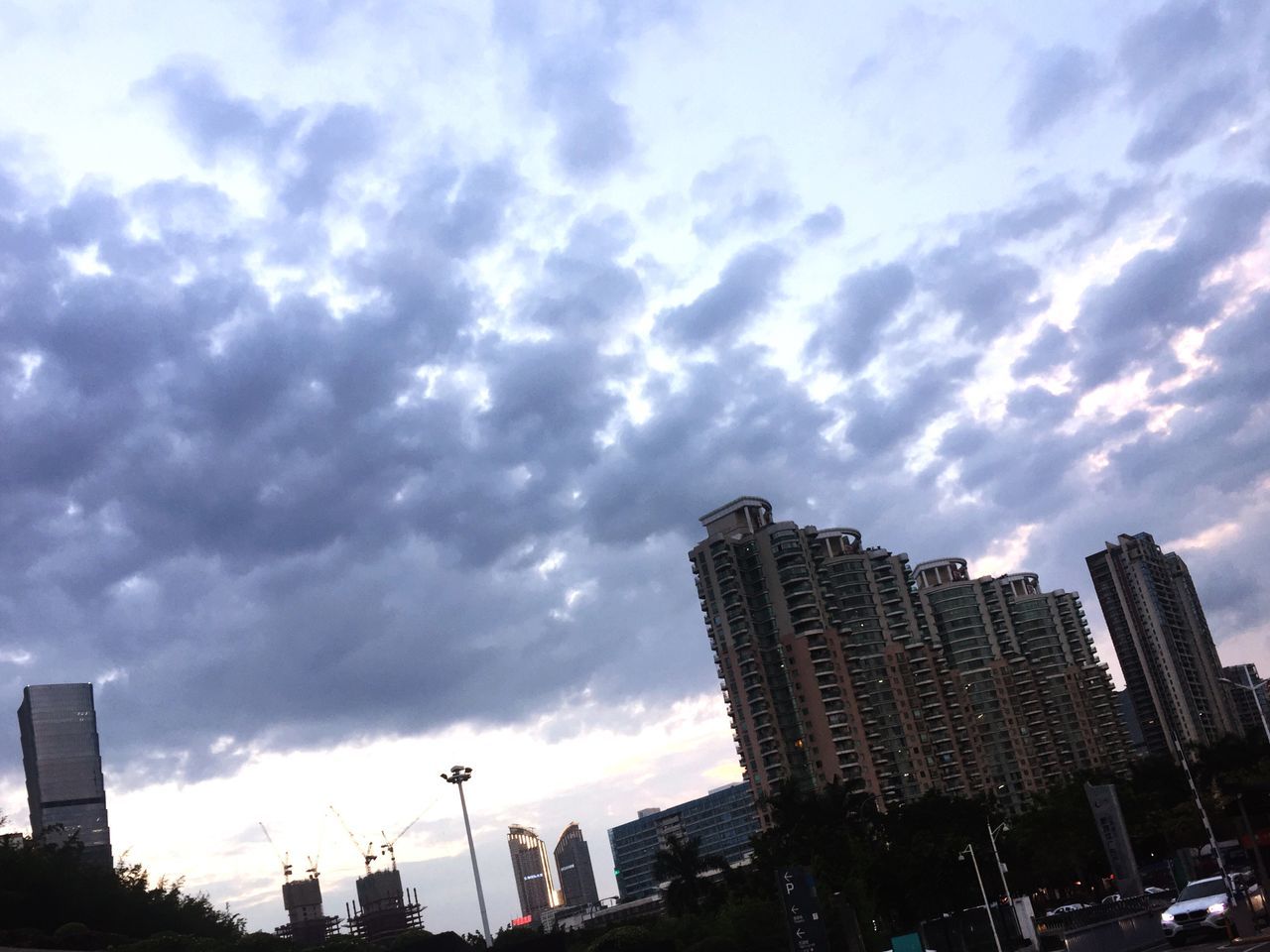 building exterior, architecture, sky, city, cloud - sky, built structure, no people, cityscape, outdoors, low angle view, urban skyline, skyscraper, day