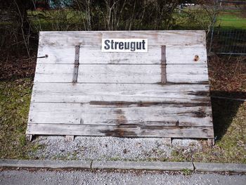 High angle view of text on wood