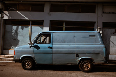 Old blue truck in the city. shadows and contrast.