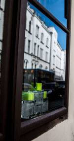 Reflection of building on glass window