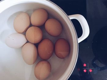 High angle view of eggs in container on table