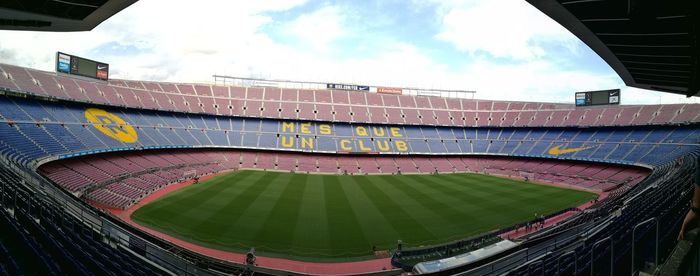 Scenic view of soccer field against sky