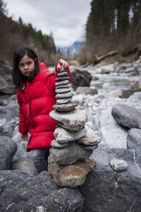 Woman on rock in snow