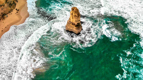 High angle view of rocks in sea