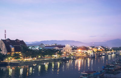 City at waterfront during sunset