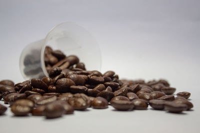 Close-up of roasted coffee beans on table