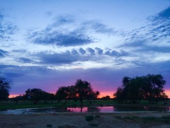 Scenic view of landscape against cloudy sky