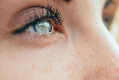 Cropped eye of young woman