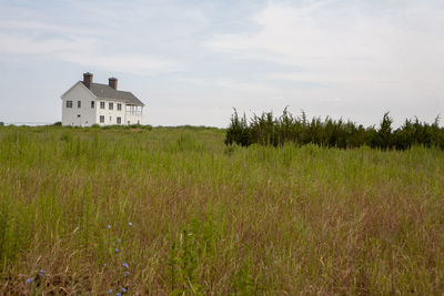 House on field against sky
