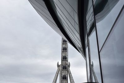 Low angle view of ferris wheel against sky