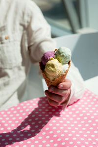 Person holding ice cream cone