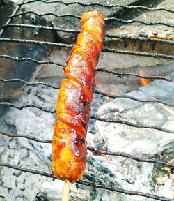 High angle view of orange on barbecue grill