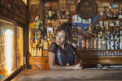 Portrait of woman sitting in restaurant