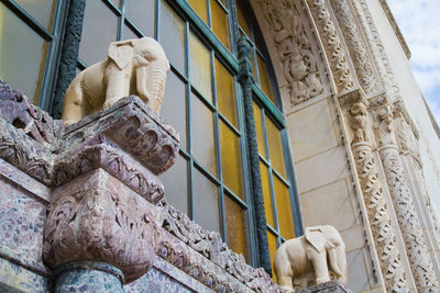 Low angle view of statue against building