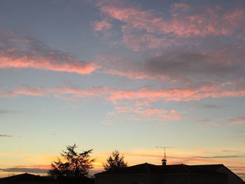 Low angle view of built structure at sunset