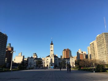 View of buildings against blue sky