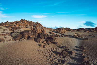 Rock formations in desert against sky