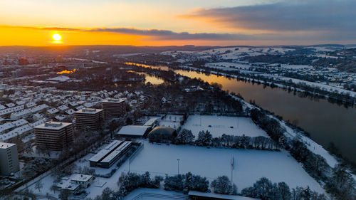 High angle view of city at sunset