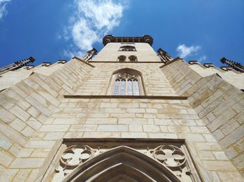 Low angle view of bell tower against sky