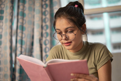 Young woman using laptop at home