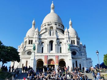 Low angle view of basilique du sacre coeur against clear blue sky