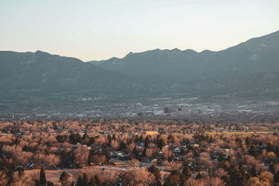 High angle view of townscape and mountains against sky