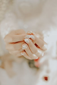 Close-up of woman holding hands