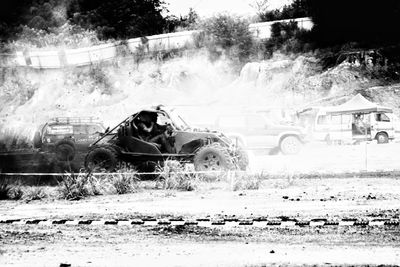 View of abandoned car on field