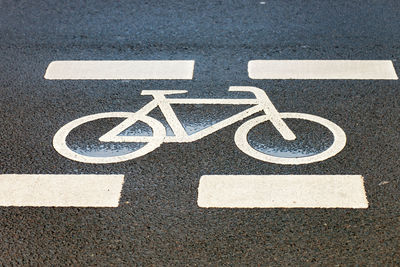 High angle view of bicycle lane symbol on road