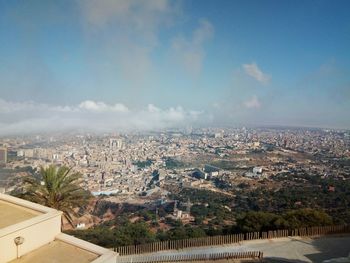 High angle view of buildings in city against sky