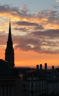 Silhouette of church against sky at sunset