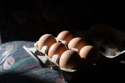 High angle view of eggs in carton