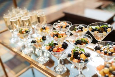 Fruits in glasses on table in weeding