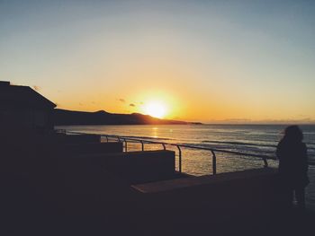 Scenic view of sea against clear sky during sunset