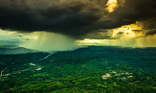 Aerial view of landscape against cloudy sky during monsoon