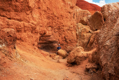 High angle view of man standing on rock