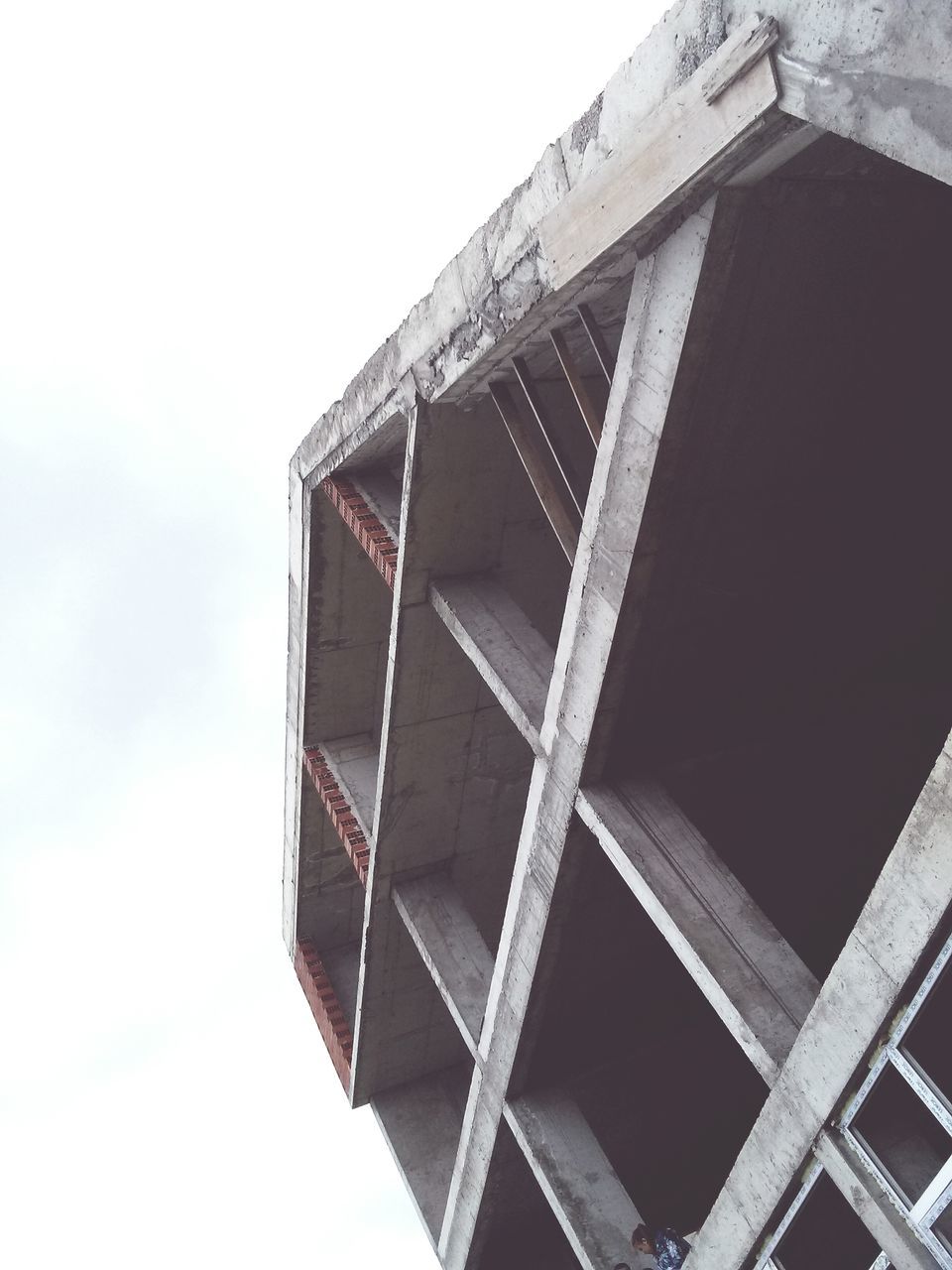 architecture, low angle view, built structure, building exterior, clear sky, tower, building, pattern, window, architectural feature, modern, sky, day, tall - high, outdoors, city, no people, glass - material, directly below, design