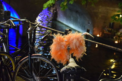 Close-up of bicycle wheel at night