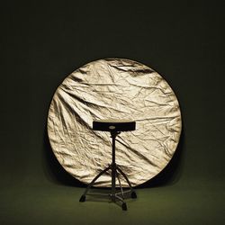 Empty seat and reflector in studio