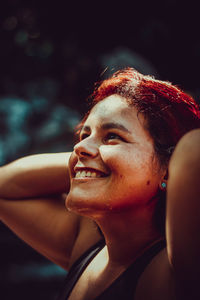 Close-up portrait of a smiling young woman