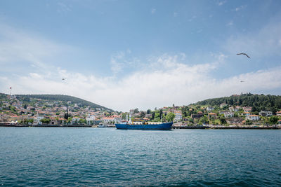 City by sea against sky