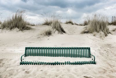 Empty beach against sky