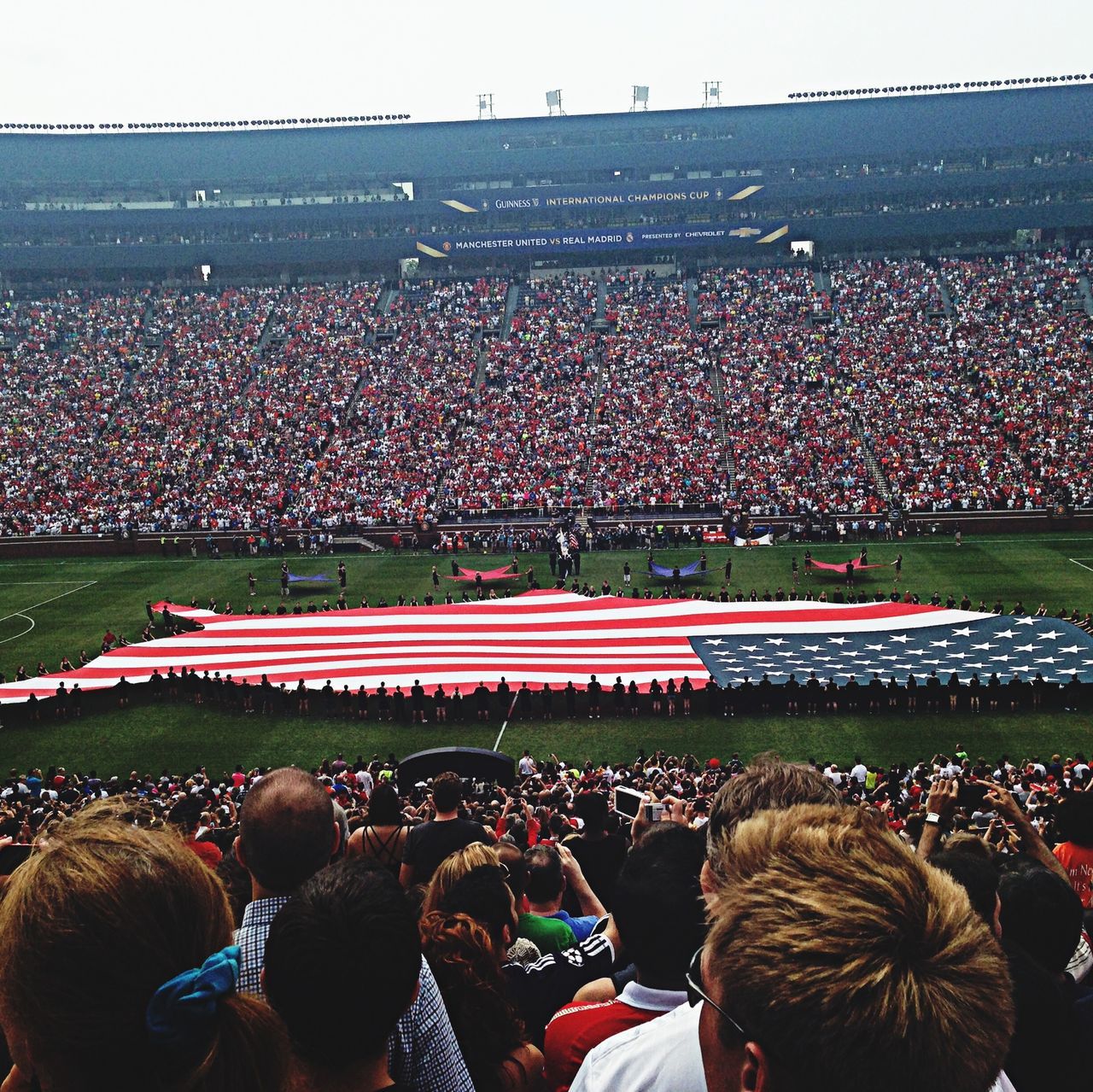 large group of people, crowd, men, person, lifestyles, leisure activity, spectator, arts culture and entertainment, event, watching, celebration, togetherness, enjoyment, stadium, mixed age range, rear view, illuminated, fun, sky